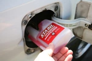 putting diesel fuel additive in a car