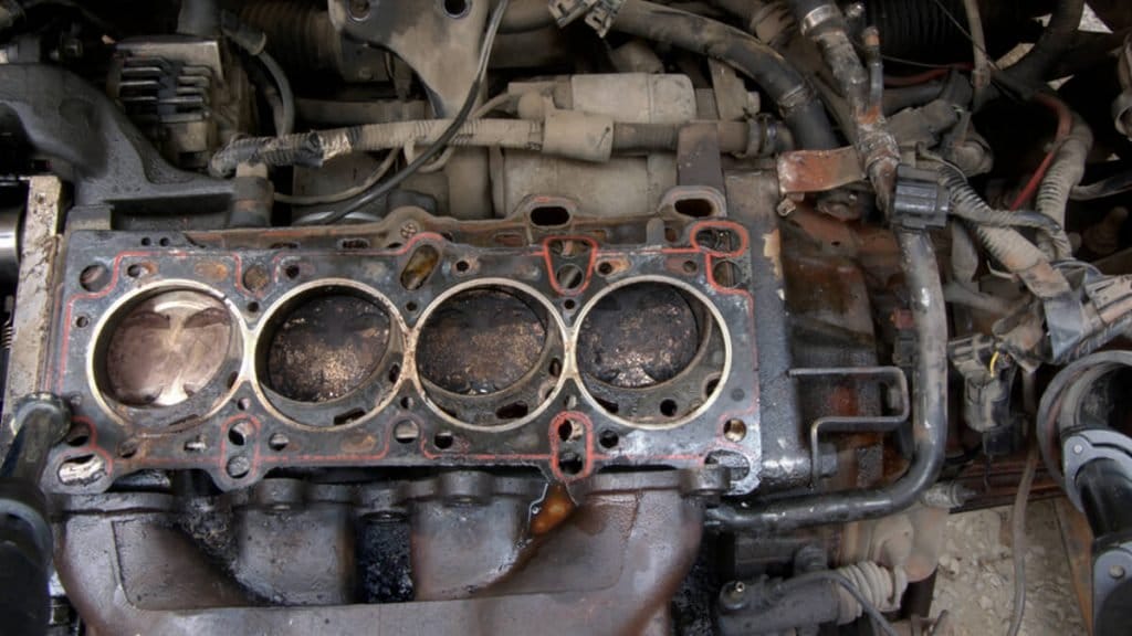 What are the symptoms of a blown head gasket