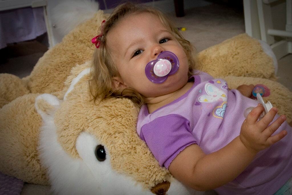 little girl with pacifier