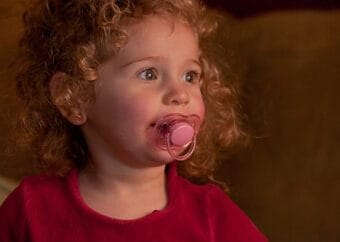 little girl with pacifier