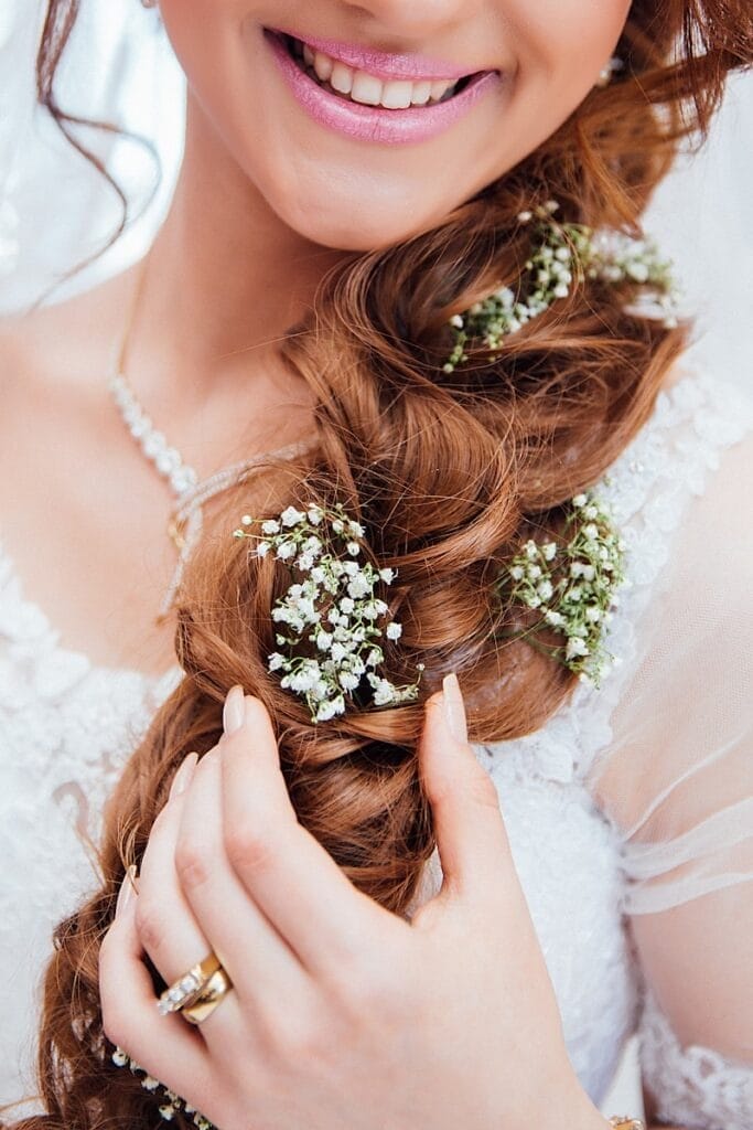 woman holding her hair with flower detoxifying